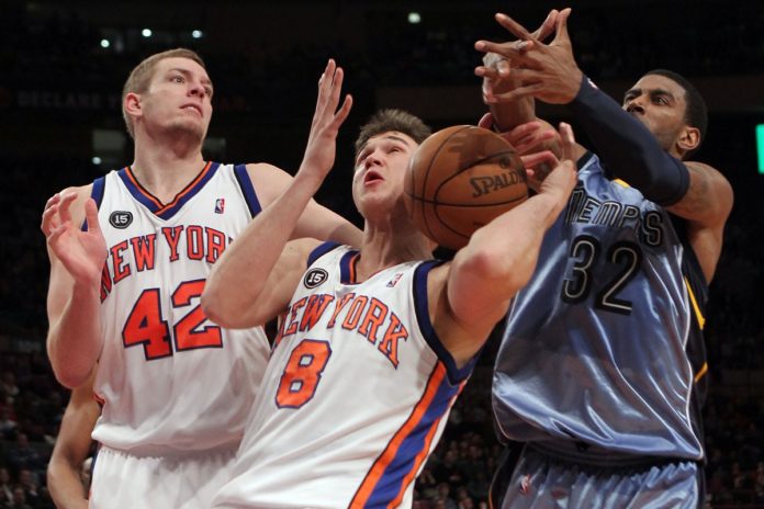 New York Knicks Danilo Gallinari (8), David Lee (42) and O.J. Mayo fight for a rebound at Madison Square Garden