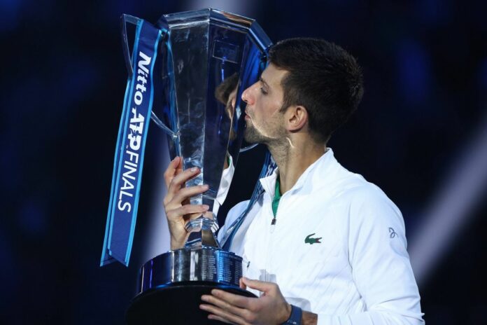 Novak Djokovic vs Casper Ruud Novak Djokovic of Serbia celebrates with the trophy at the end of the final singles match