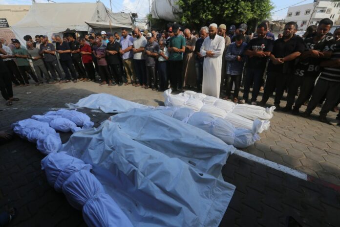 Relatives of the Palestinians died in Israeli attacks, mourn as they receive the dead bodies from the morgue of Al-Aqsa Hospital, Dair El_Balah, Gaza Strip, Palestinian Territory - 10 Aug 2024